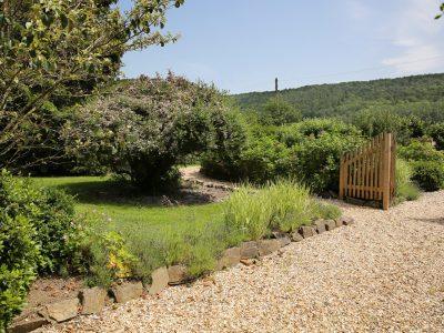 Woodpecker Way: Garden area shared with adjacent apartment