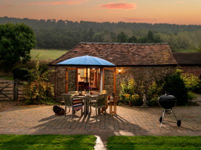 Garden Cottage: At dusk with Wenlock Edge behind