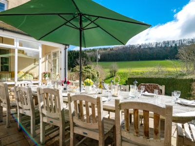 The Manor House: Patio with garden furniture & view of Wenlock Edge