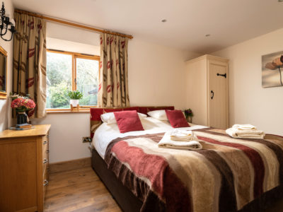 Toad Hall: 'Muriel' bedroom (ground floor) with ensuite shower room (superking or twin)