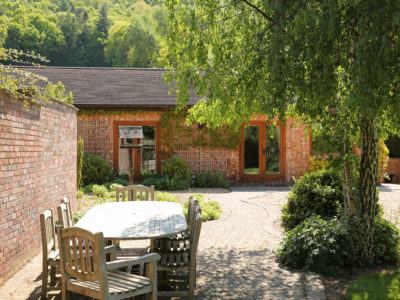 Curlew Cottage: Large paved patio area with garden furniture & charcoal BBQ