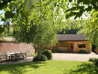 Curlew Cottage: Paving from front entrance to patio area and flat lawn