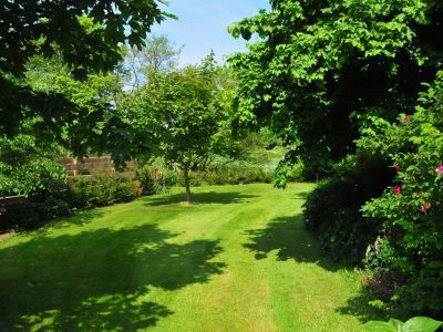 Curlew Cottage: Private garden leading down to Eaton Brook (fenced off for safety)