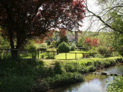 View to The Manor House across Eaton Brook (fenced off for safety)