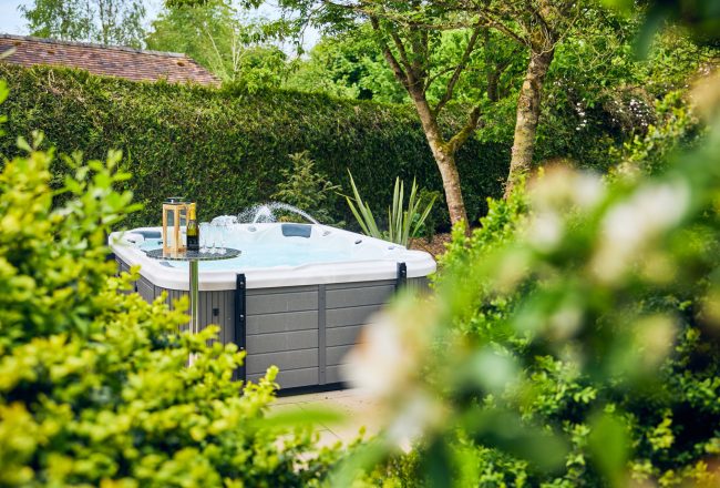 Enjoy the secluded location of the hot tub to enjoy the garden view