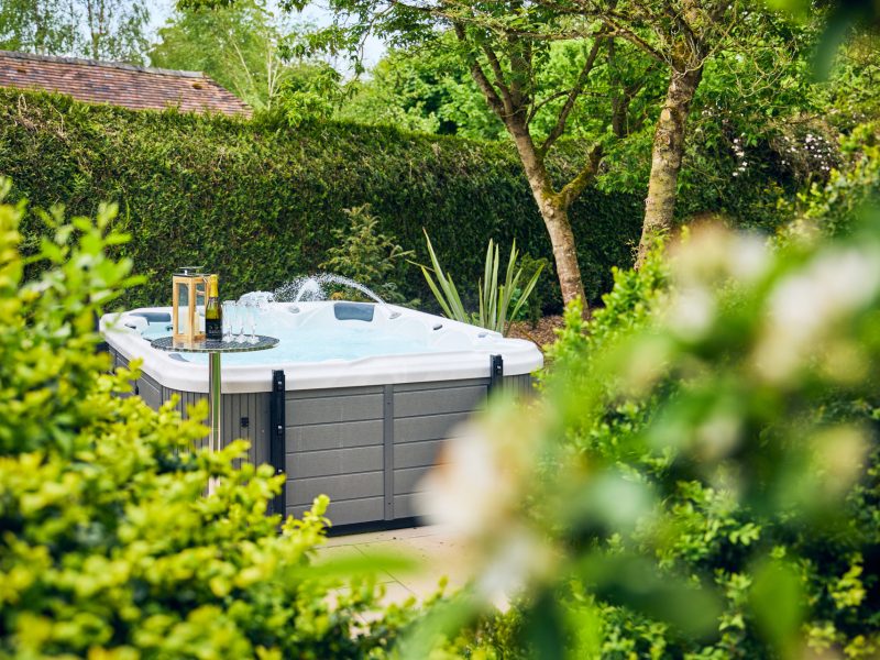 Enjoy the secluded location of the hot tub to enjoy the garden view
